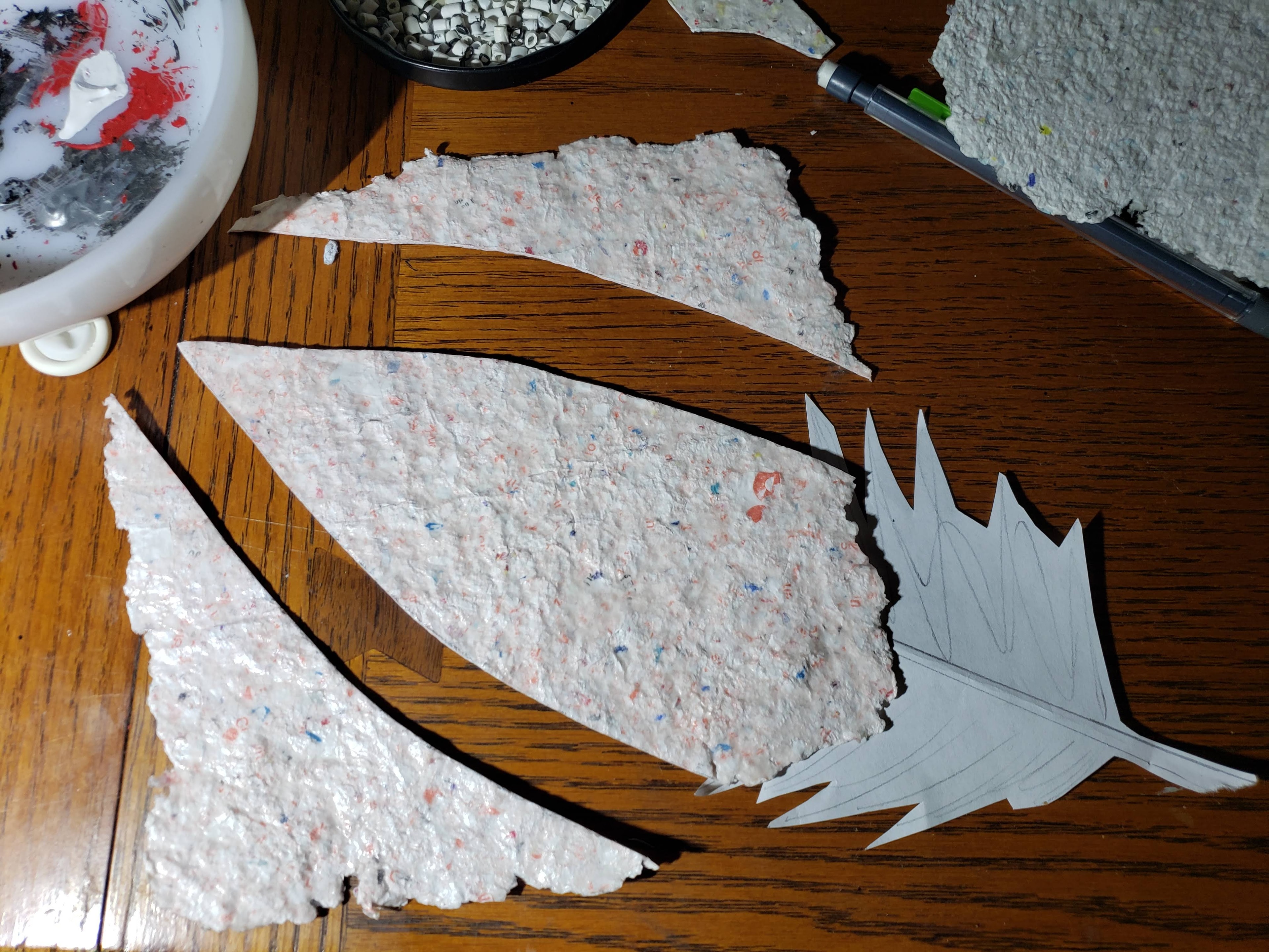 Draping and layering receipts on the dress form